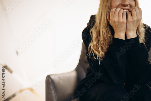 Woman having tooth ache and waiting for her dentist at dentistry