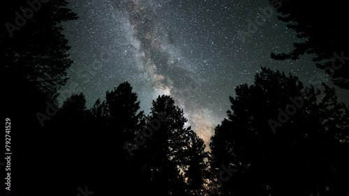 Beautiful Milky way timelapse of the galaxy moving through the night sky deep in the forest till dawn Smolikas mountain Greece photo