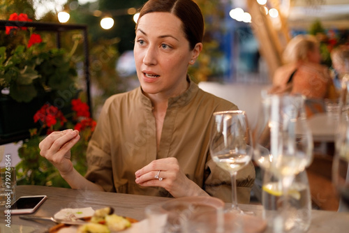 Woman has an emotional conversation at restaurant