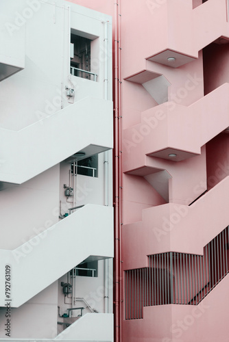 Photography Minimalist View of a Pink and White Apartment Building Stairs