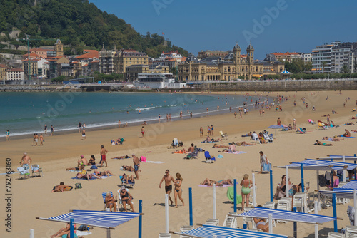 People enjoy the seaside at La Concha beach in San Sebastian, Basque Country, Euskadi, Spain, Europe