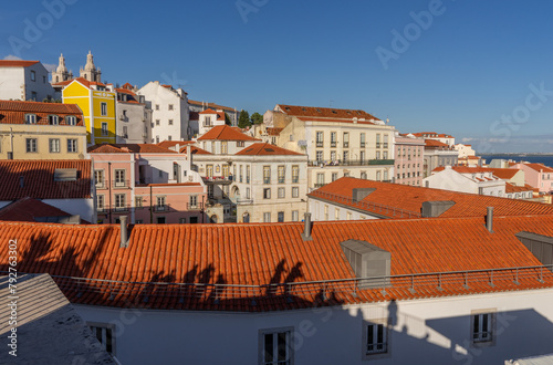 Tourists and visitors enjoying views of the city at sunset in Lisbon, Portugal photo