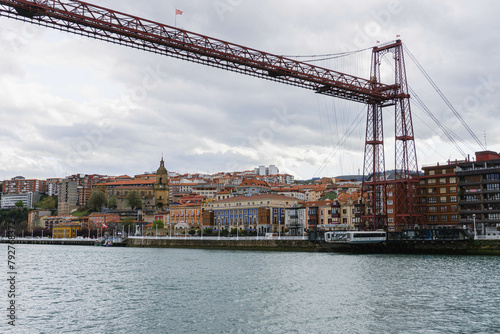 hanging iron red bridge over the river in north of spain vizcaya 