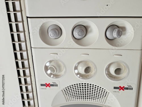 Tablou pe pânză Overhead cabin panel, cabin signs and lights, fasten your seat belt sign is on