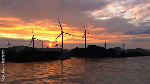 Wind turbine at sunset. Wind turbine on the sea.