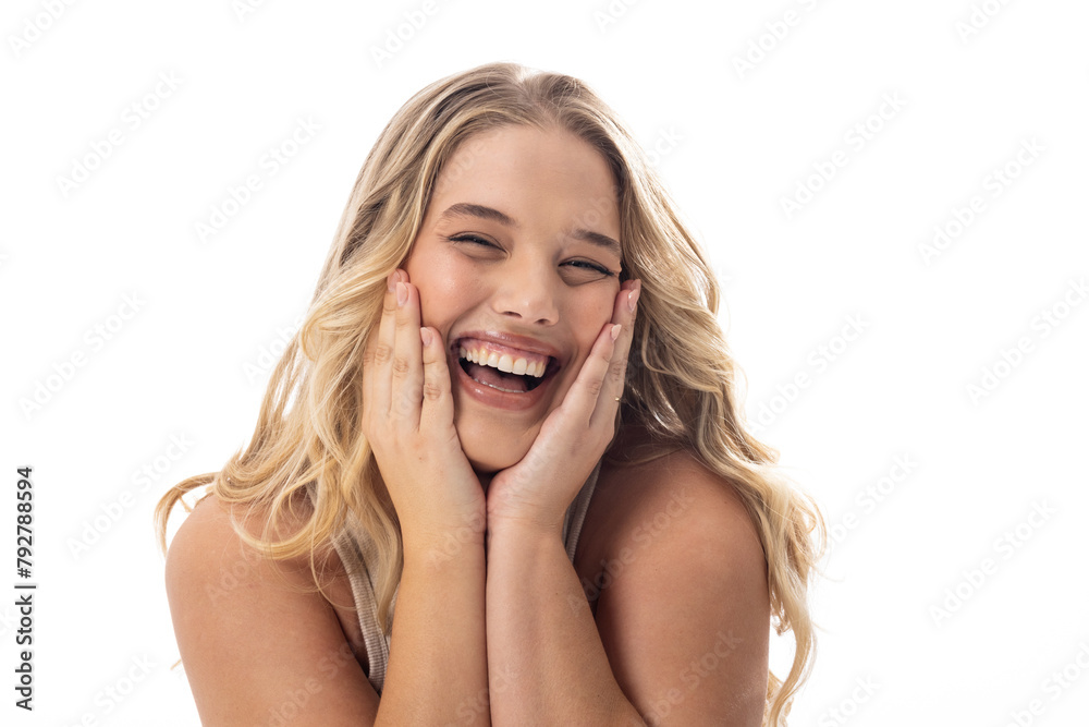 Plus size Caucasian woman laughs, holding face, on white background, copy space Plus size Caucasian woman laughs, holding face, on white background, copy space