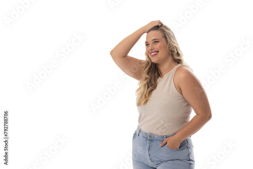 A young Caucasian plus-size model stands on white background, copy space