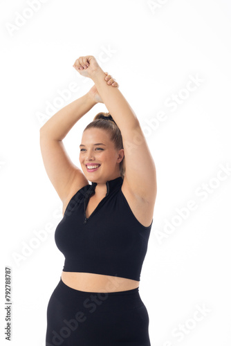 A young Caucasian plus size model with blonde hair on white background, copy space
