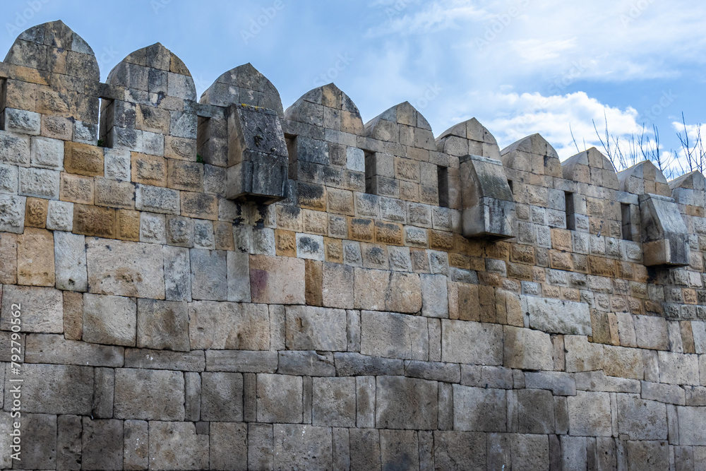 The fortress wall. It is a monument of ancient Persian fortification architecture. The wall is made of large stone blocks.