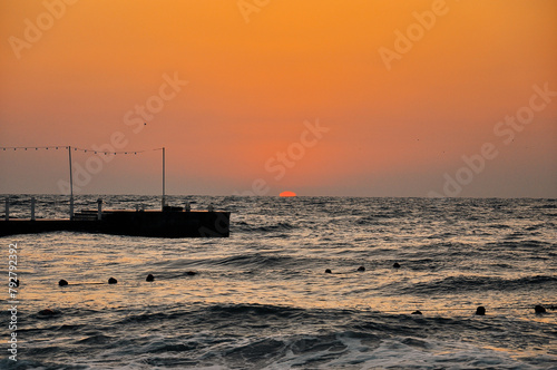 Sunset at the Imperial Beach. Cloudy sunset and pier in San Diego. photo