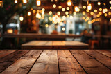 Empty wooden table top with blurred bokeh background of night bar and restaurant lights for product display montage