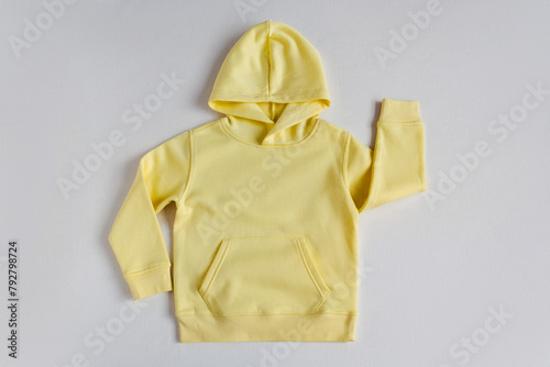 Yellow sweatshirt mockup on the white background. Template sweatshirt front for design and print. Hoodie with pocket, long sleeve.  Basic clothing witout logo. Top view