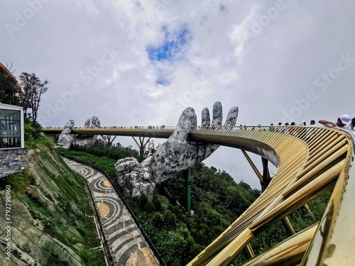 Ba Na Hills - Danang - Vietnam: 13.07.2022 Golden Bridge in cloudy day. This is in Ba Na Hills French Village Mountain Resort, The new tourist attraction place in Da Nang, Vietnam.
