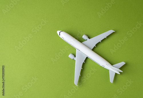 Airline plane on green background. Airline. World communication and commercial flights. Arrival and departure. Passenger transportation. Ecology and success concept. Business and tourism.