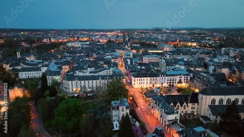 4K Aerial view of a Grand Duchy of Luxembourg , city skyline to night at Grund along Alzette river in the historical old town of Luxembourg photo