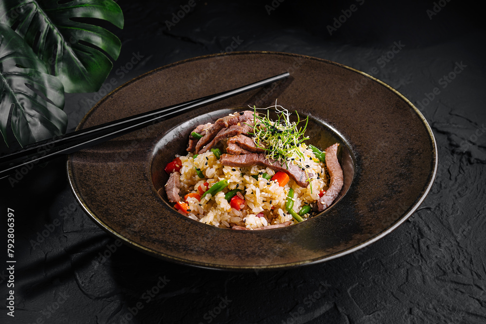 Delectable asian beef fried rice in elegant presentation