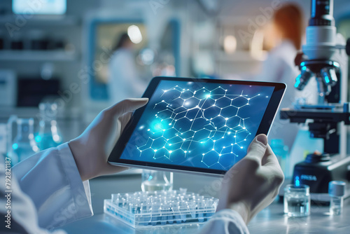 Scientist holding tablet with molecular structure on screen in a modern lab. © lenblr