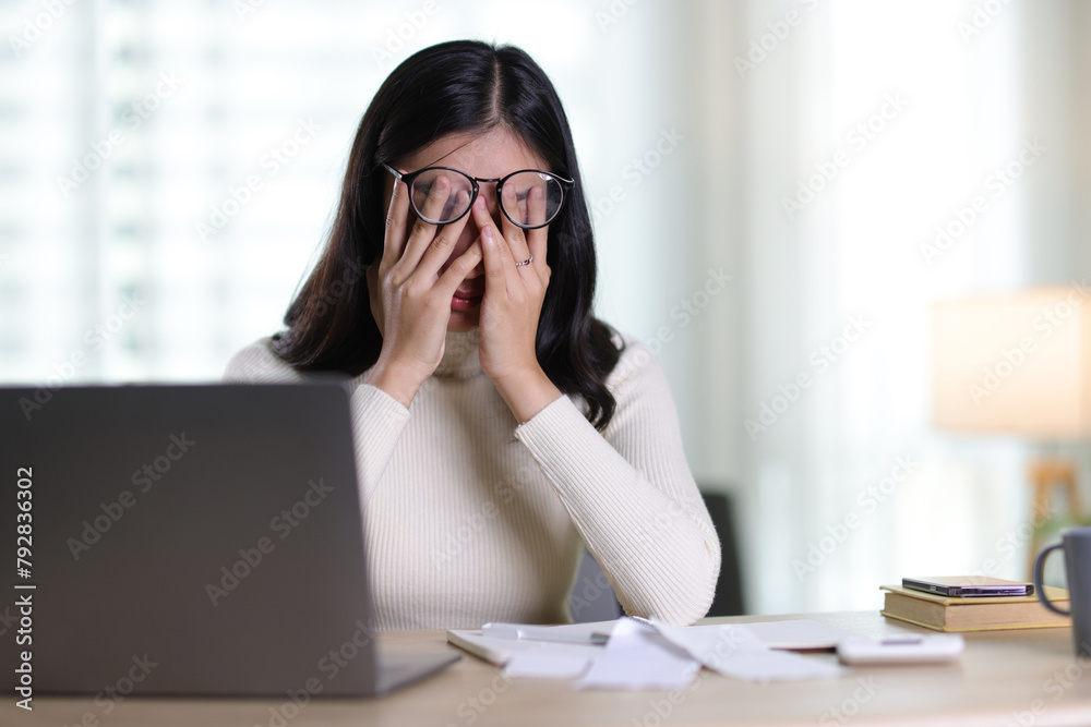 Woman with financial problems at home. Woman is stressed over financial bills and expenses at home. Woman with financial problems at home. Woman is stressed over financial bills and expenses at home.