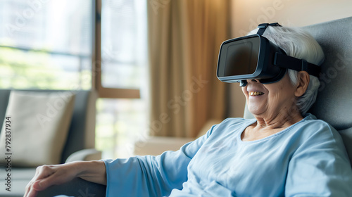 Happy elderly woman wearing VR glasses future technology while relaxing at home. Retirement people and virtual reality glasses technology