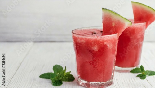 Watermelon juice on white wooden background. 