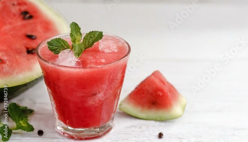 Watermelon juice on white wooden background.