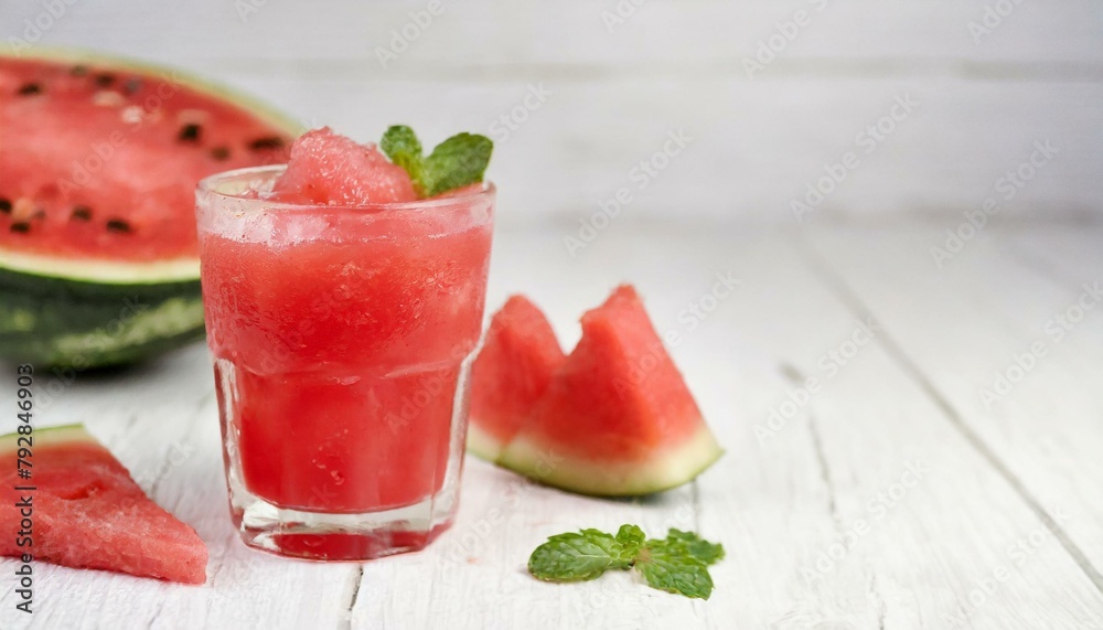Watermelon juice on white wooden background.
Watermelon juice on white wooden background.