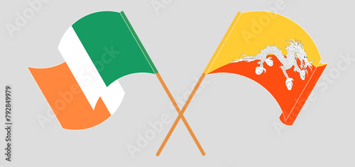Crossed and waving flags of Ireland and Bhutan photo