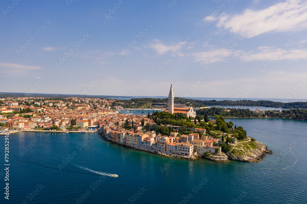 Rovinj, Croatia: Boat sailing around the Rovinj medieval old town with its Venetian campanile in Istria by the Adriatic sea in Croatia