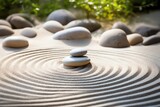 Zen garden with raked sand patterns around smooth stones, promoting mindfulness and tranquility in a serene setting