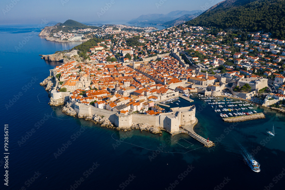 Dubrovnik, Croatia: A tour boat leaving the Dubrovnik medieval old town port by the Adriatic sea in Croatia on a sunny summer