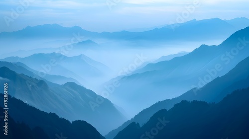 Serene and Misty Mountain Valley Landscape with Layers of Blue Hazy Ridges Capturing the Beauty and Grandeur of the Wilderness