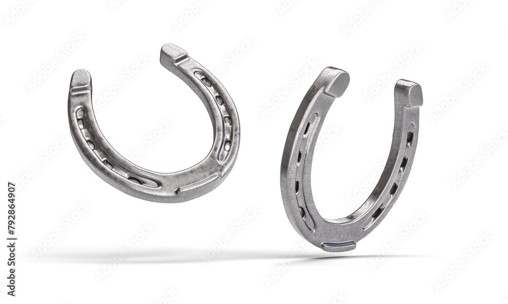 Pair of silver horseshoes on white background
