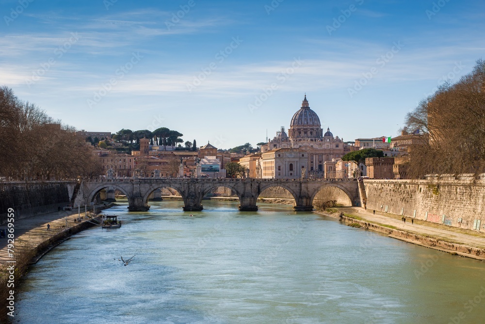 Rome Skyline with Vatican St Peter Basilica of Vatican and St Angelo Bridge crossing Tiber River in the city center of Rome Italy. It is historic landmark of the Ancient Rome and travel destination.

