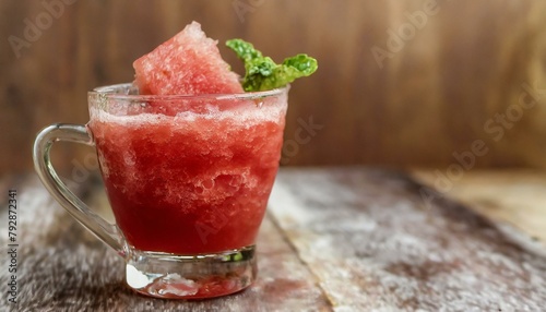 Watermelon juice on wooden background. Macro, close-up. 