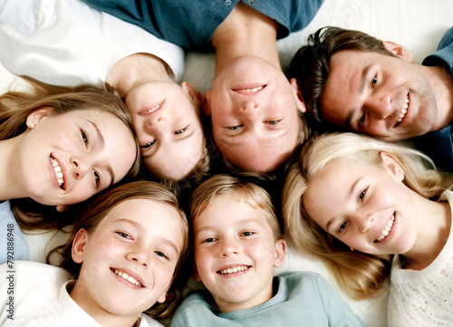 Portrait of a Secure Hugging Young and Happy Family in Loving Close-up with Smiling Faces Together