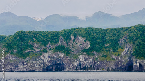 A unique landscape of coastal sheer cliffs and eroded caves on the west edge of a volcanic plateau around the Goko Lakes in Shiretoko Peninsula, East Hokkaido, Japan. photo