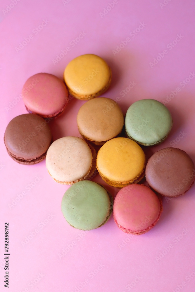Colorful macarons on pink background. Selective focus. Colorful macarons on pink background. Selective focus.