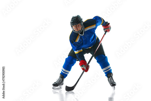 Canvas Print Studio shot of powerful hockey player in full stride, stick low and ready to pass against white studio background