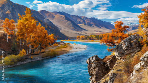 Blue river with yellow autumn trees in the mountains.