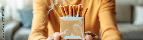 An image of a person throwing out a pack of cigarettes, symbolizing the decision to quit smoking photo