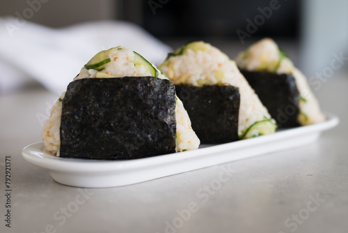 Homemade Onigiri Kyuri, rice triangle with cucumber, sesame seeds, ginger, nori seaweed (ID: 792921371)
