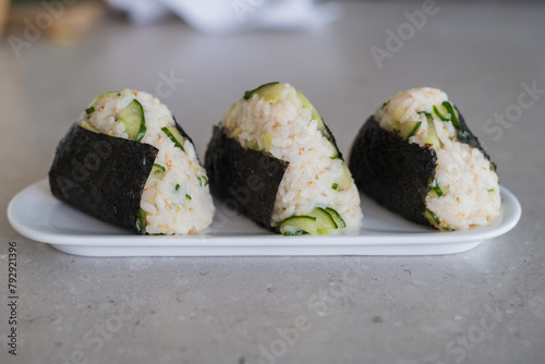 Homemade Onigiri Kyuri, rice triangle with cucumber, sesame seeds, ginger, nori seaweed (ID: 792921396)