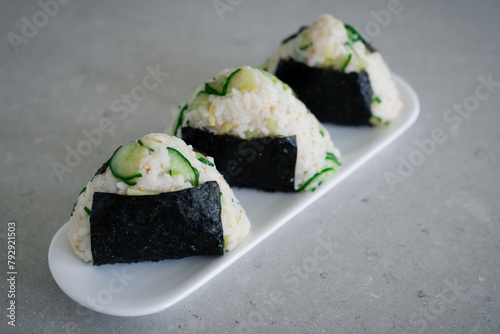 Homemade Onigiri Kyuri, rice triangle with cucumber, sesame seeds, ginger, nori seaweed (ID: 792921503)