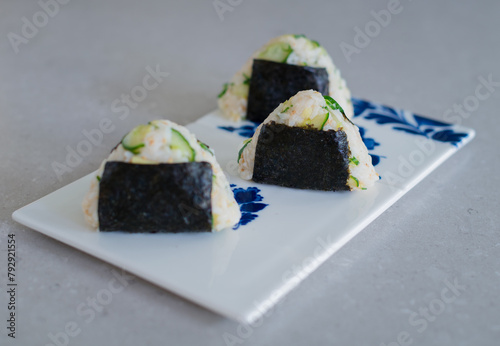 Homemade Onigiri Kyuri, rice triangle with cucumber, sesame seeds, ginger, nori seaweed (ID: 792921554)