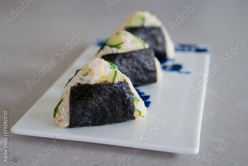 Homemade Onigiri Kyuri, rice triangle with cucumber, sesame seeds, ginger, nori seaweed (ID: 792921707)