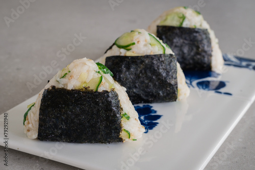 Homemade Onigiri Kyuri, rice triangle with cucumber, sesame seeds, ginger, nori seaweed (ID: 792921940)