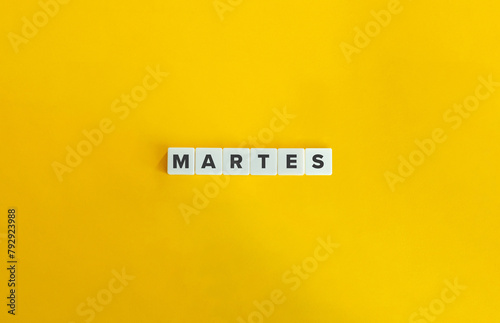 Word MARTES. Tuesday in Spanish. Text on Block Letter Tiles on Flat Background. Minimalist Aesthetics.