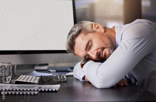 Mature man, sleeping and tired in office with computer, desk and exhausted as employee with deadline. Company, business and fatigue from administration work or overtime in pc as project manager