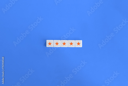 5 Orange Stars Banner. Excellency, Rating, Review, First Class, First Rate, Superior, Top-notch Concept. Letter Tiles on Blue Background. Minimalist Aesthetics.