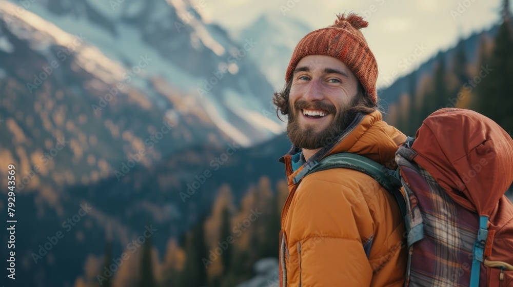 Beautiful man wearing hiking clothes, smiling with happiness, adventure traveling alone on the top of mountains with backpack in vacation trip on weekend